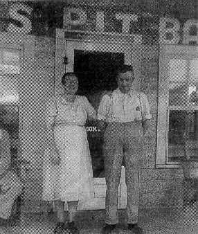 Noah and Julie Melton in front of Melton's Pit Barbecue