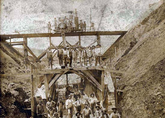 32 Unknown Railroad Workers building a Railroad Bridge